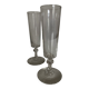 Pair of crystal champagne flutes with a button foot, 1960.