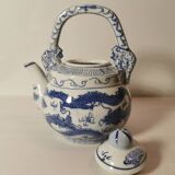 Old Chinese blue and white teapot in vintage ceramic with dragon decor