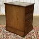 Office cabinet in oak with English leather top from the 1990s.