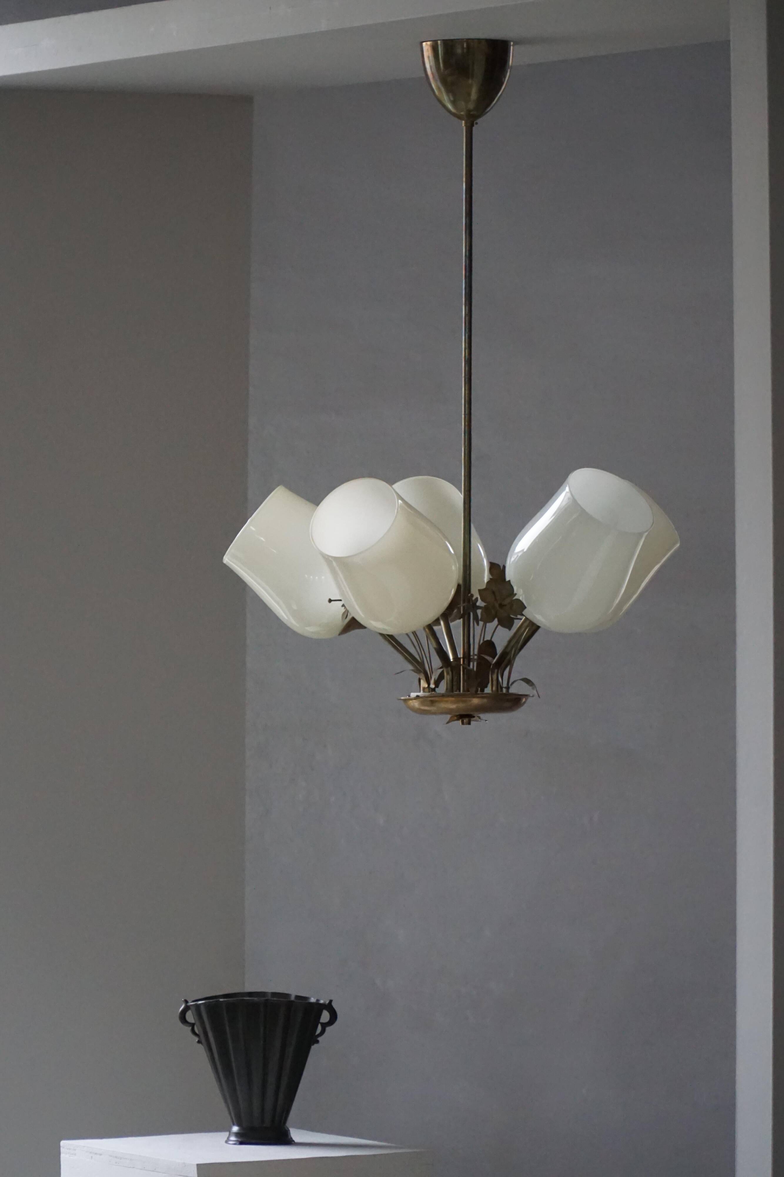 Five-branch brass and glass chandelier by Paavo Tynell for Idman OY Finland, 1940s.