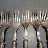 Old silver fish forks with bone handles