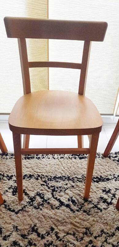 Set of 4 light wood bistro chairs stamped Baumann and Thonet.