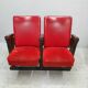 Series of 5 red skai and patinated cast Theater chairs