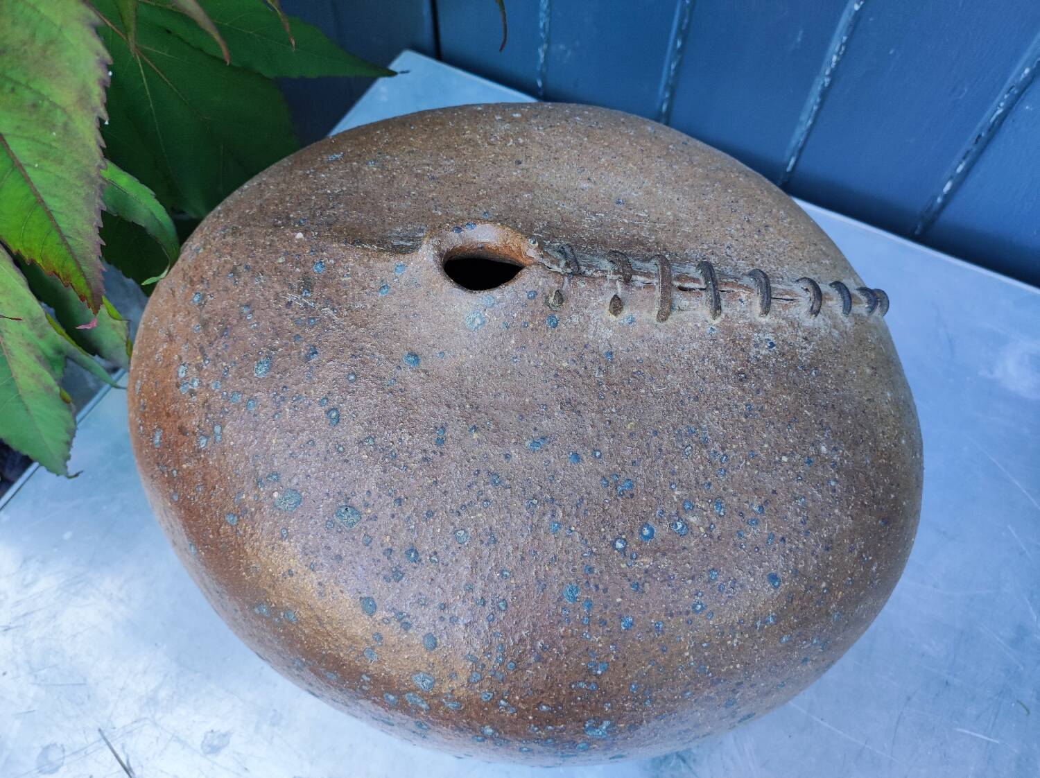 Vintage sandstone vase, in the shape of a rugby ball, signed