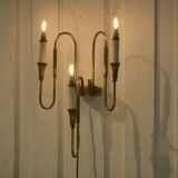 Monumental bronze wall light with three arms, neoclassical Art Deco from the 1940s.