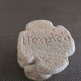 Candlestick in carved stone, signed