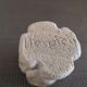 Candlestick in carved stone, signed