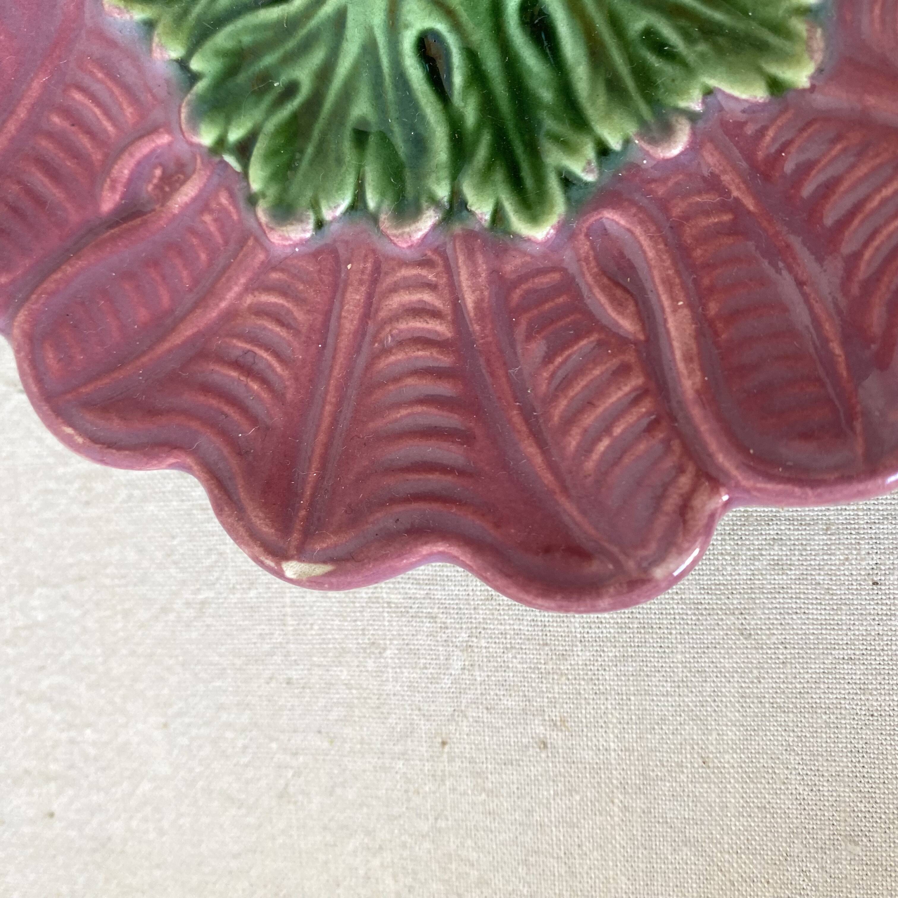 Antique slip candlestick depicting a flower