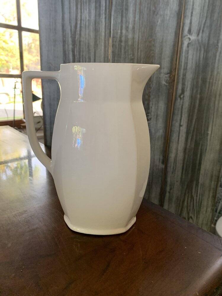 Vintage ceramic pitcher in white and blue from Gránitgyár Budapest, 1960s — floral halo pattern, square handle.