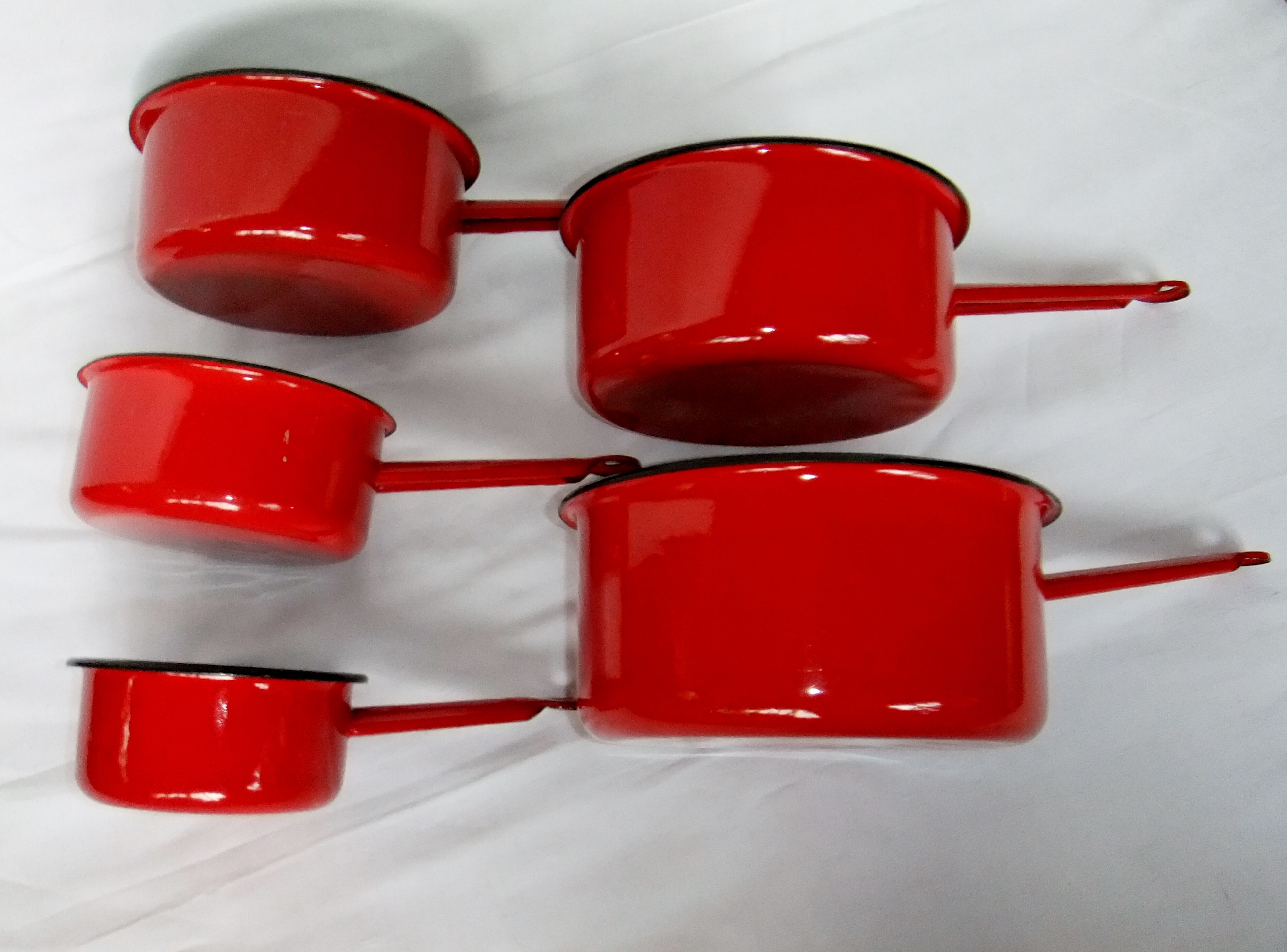 Red enamelled sheet metal pans