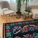 Vintage Romanian wool carpet floral design on black background 235x150cm