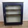Vintage low glass-fronted library in midnight blue, 1950s.