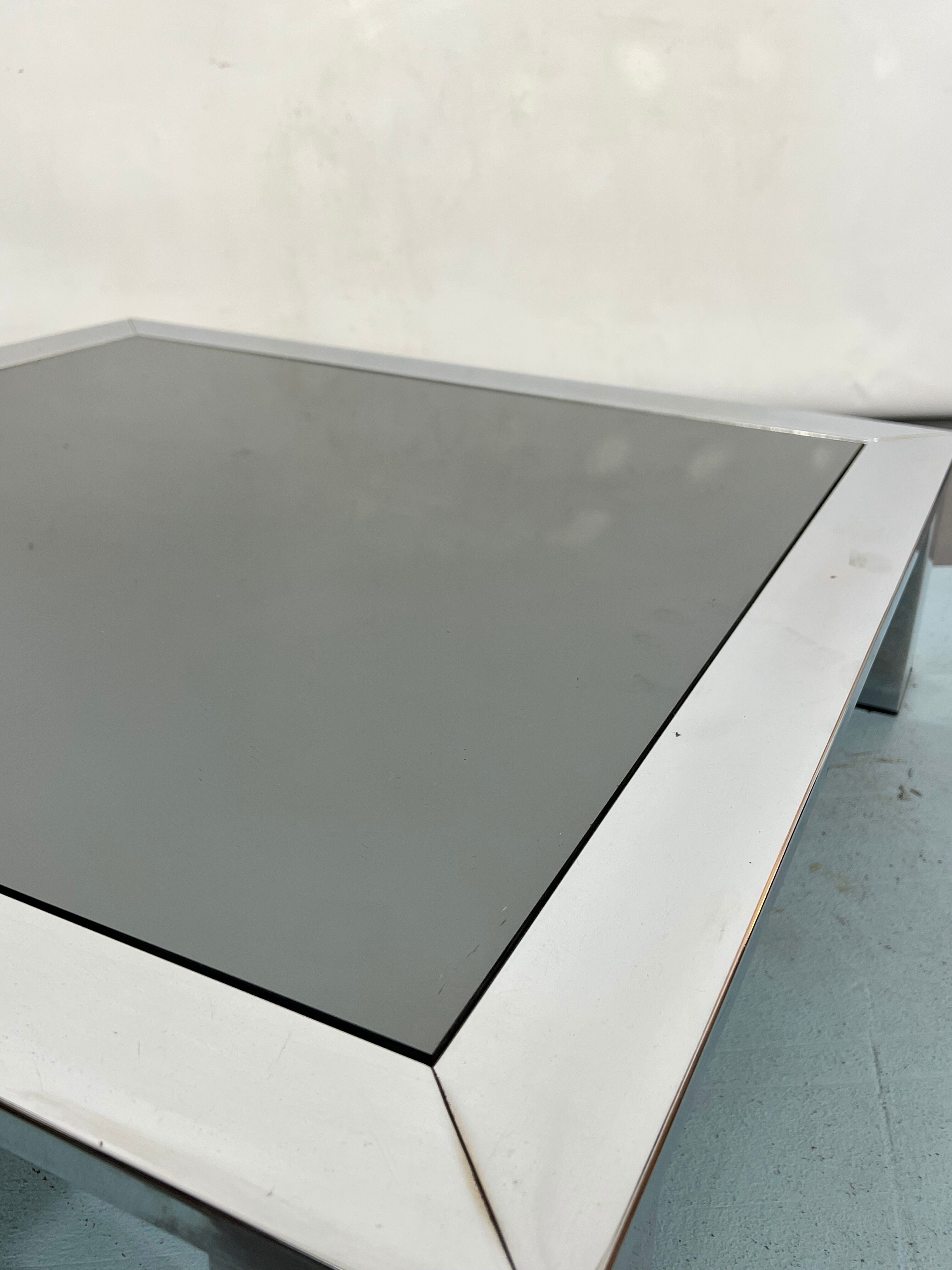 Mid-century chrome and dark mirror glass side table attributed to Saporiti. Italy 1970s