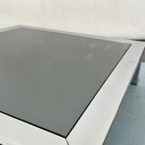 Mid-century chrome and dark mirror glass side table attributed to Saporiti. Italy 1970s