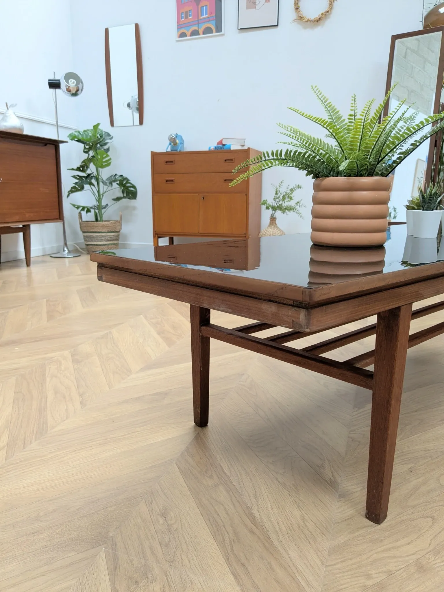 Vintage Danish coffee table in teak with a black top from the 1960s.