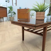 Vintage Danish coffee table in teak with a black top from the 1960s.
