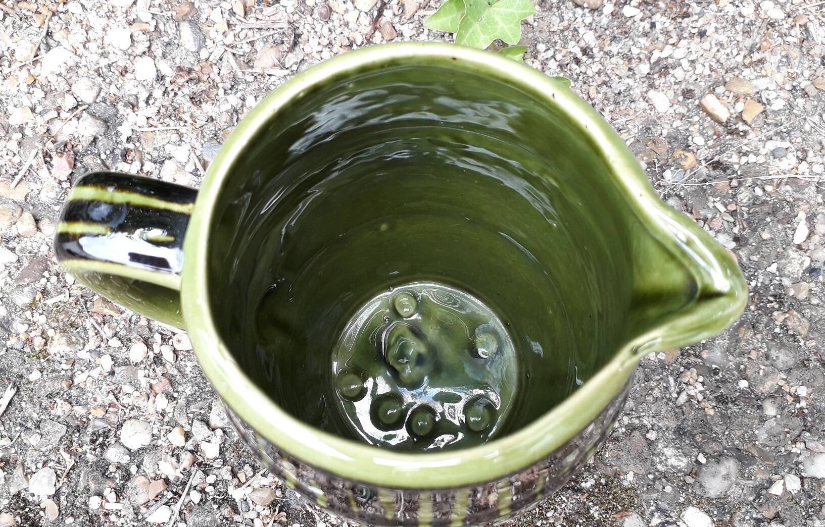 Green and brown ceramic jug