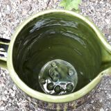 Green and brown ceramic jug