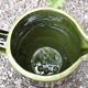 Green and brown ceramic jug