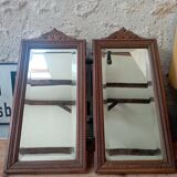 Set of two bevelled mirrors in moulded oak.