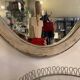Large old oval mirror with beige patina wooden frame early 20th century
