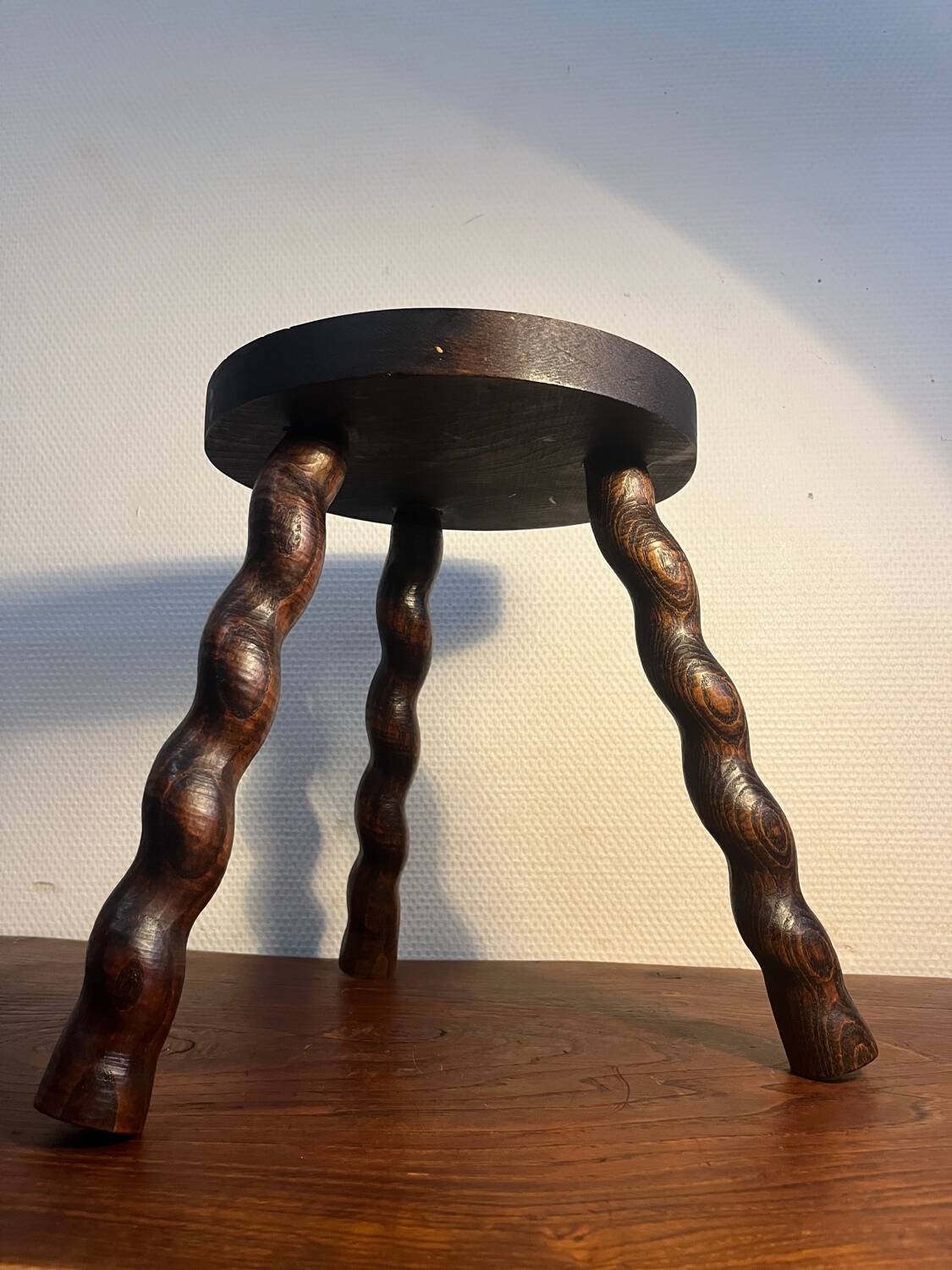 Round tripod stool with turned wooden legs