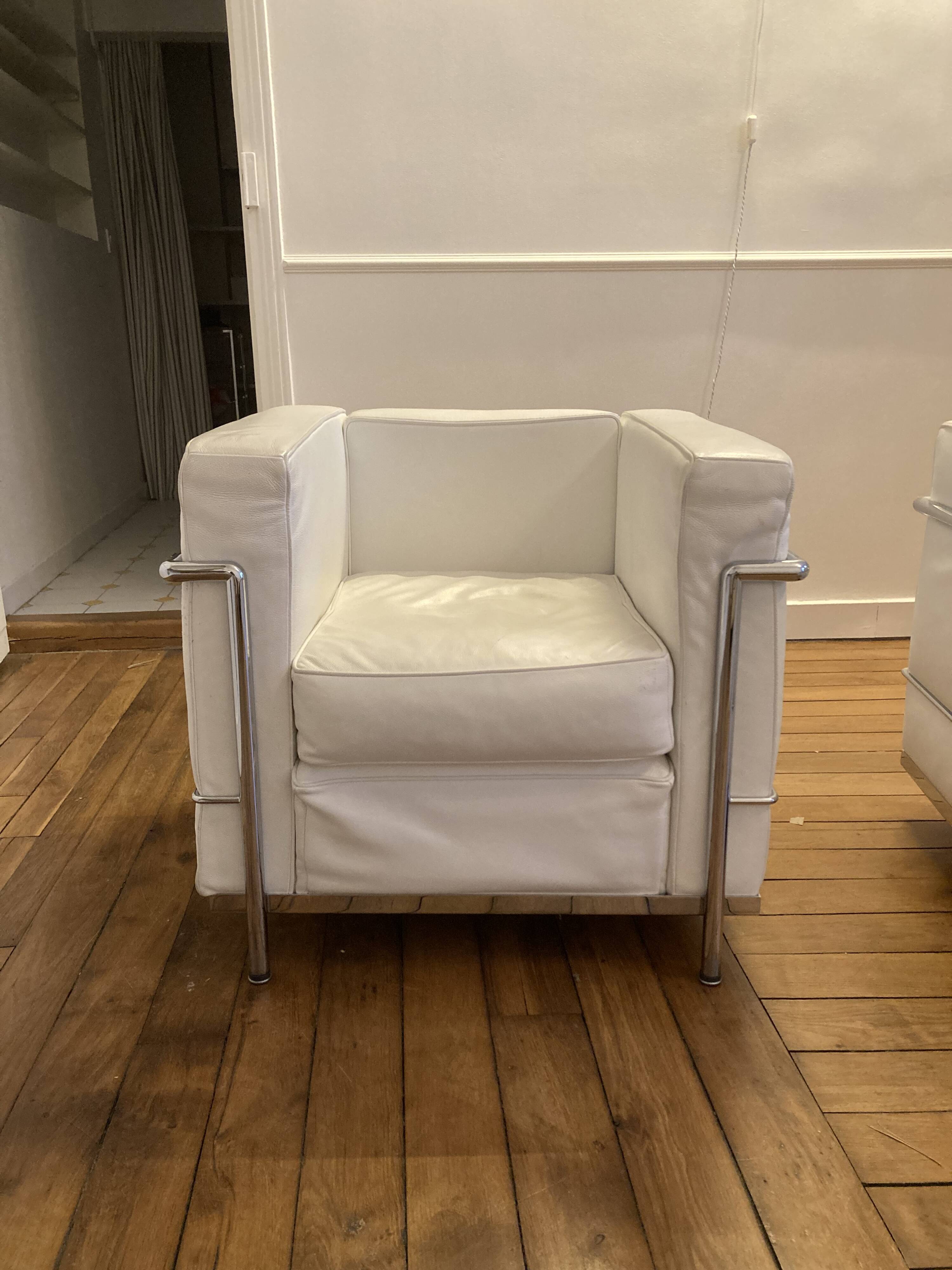 Pair of white leather and chrome armchairs