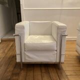 Pair of white leather and chrome armchairs