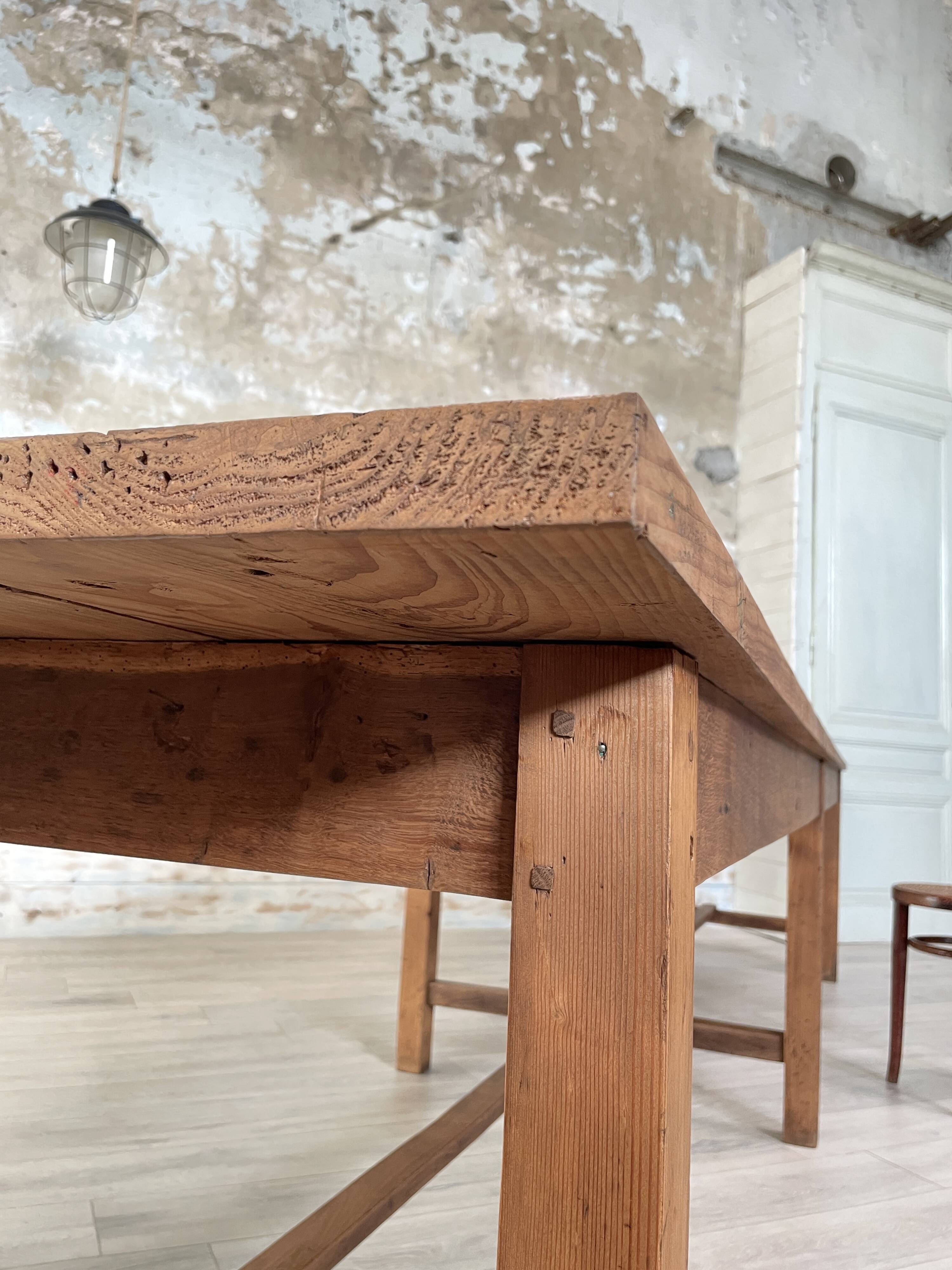 Solid wood workshop table with straight legs.