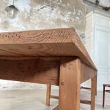Solid wood workshop table with straight legs.