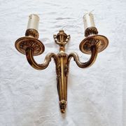 French Empire-style wall sconce or chandelier in bronze with an antique gold patina.