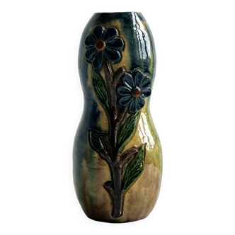 Very colorful glazed earthenware vase, old vase with floral decoration.