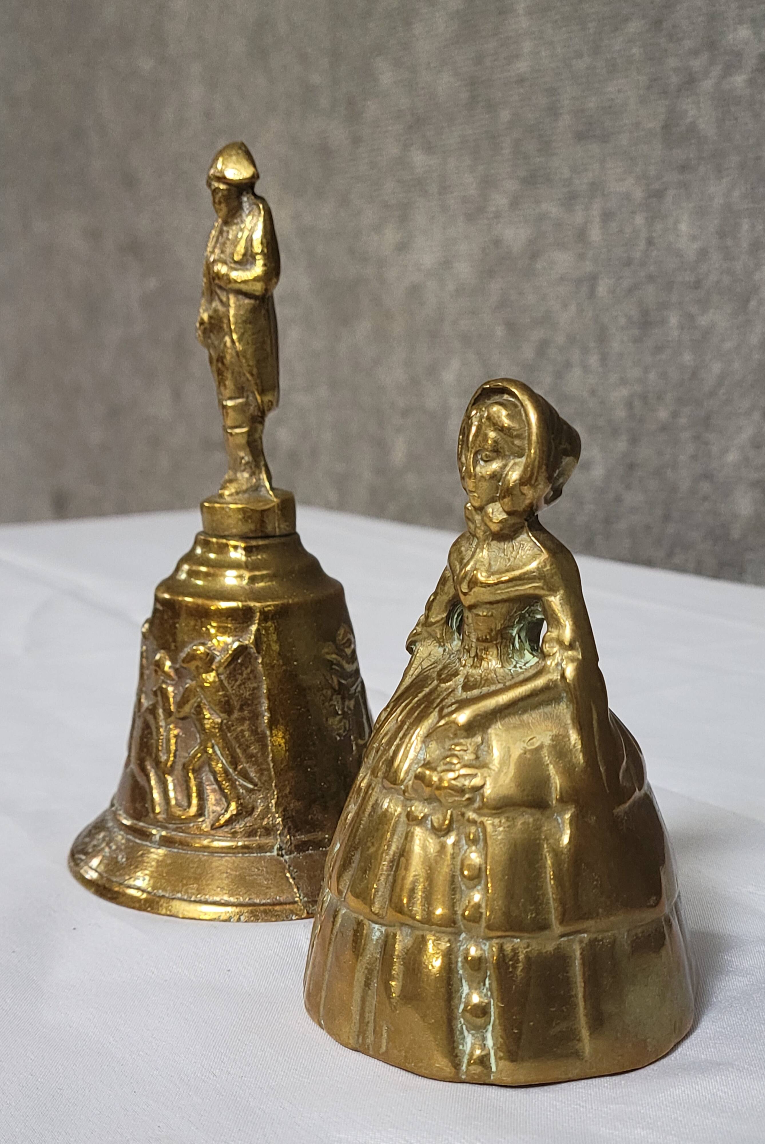 Two vintage bronze table cloches, finely chiseled and gilded