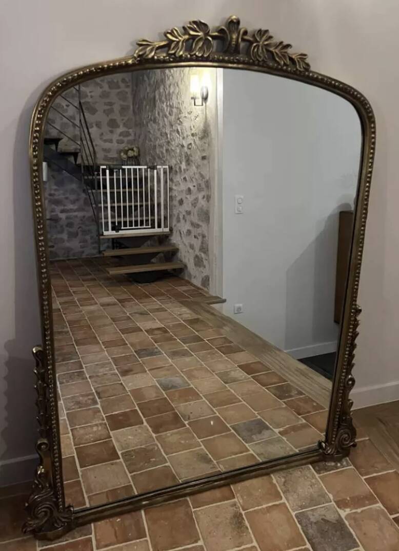 Large gilded mirror with pediment