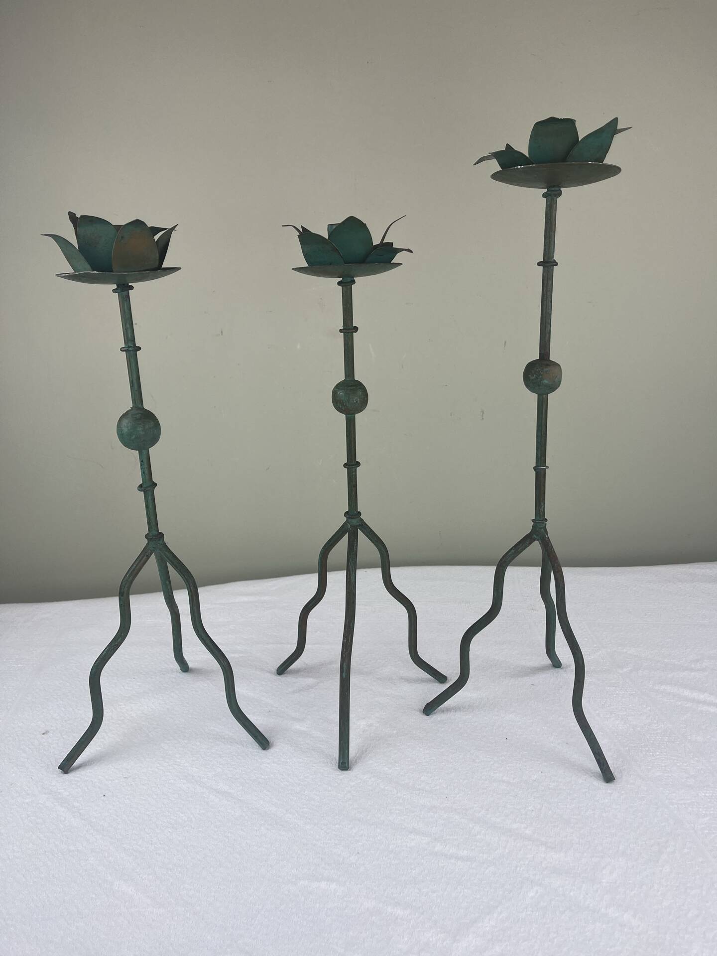 Sculptural candle holder trio