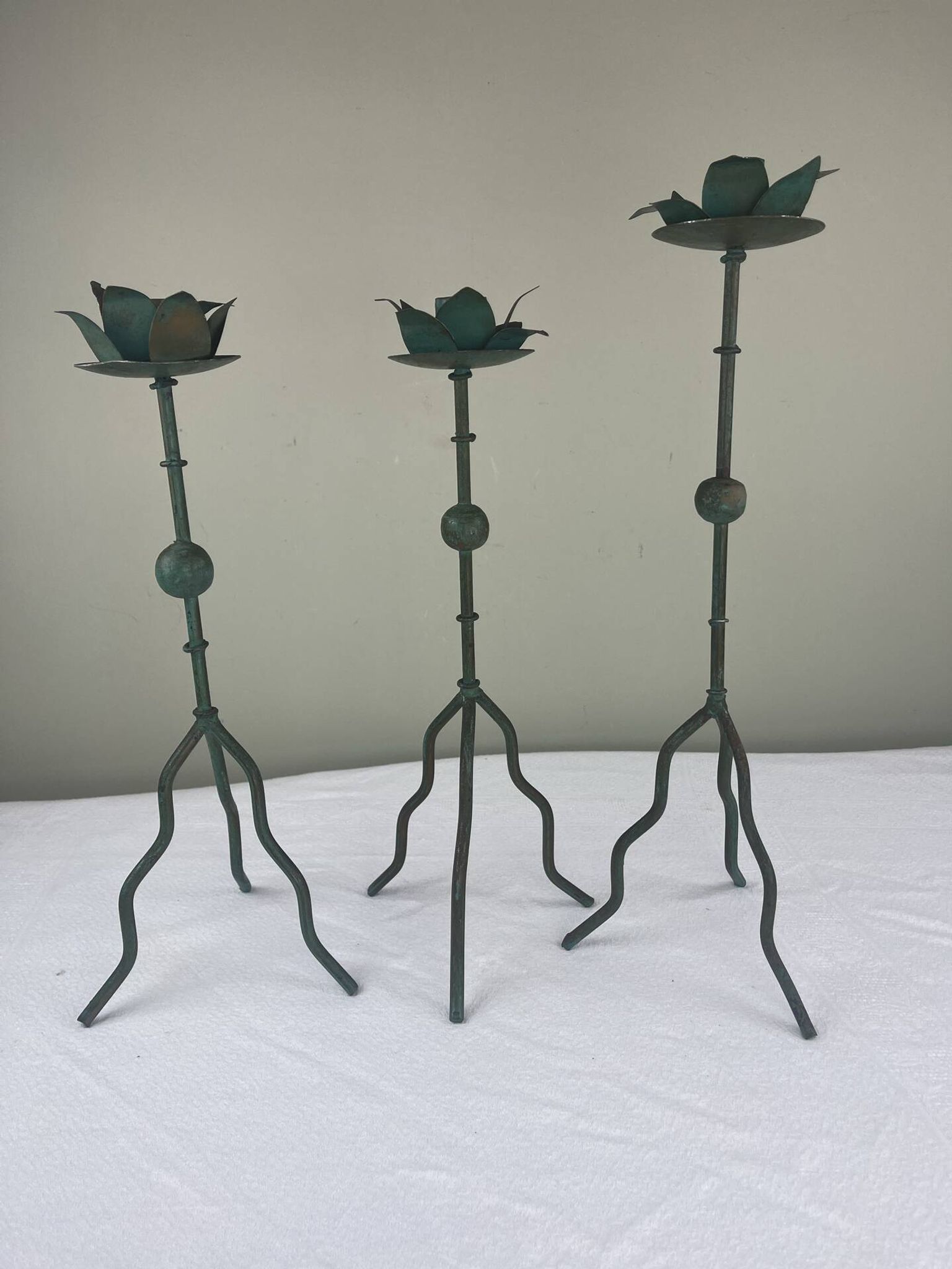 Sculptural candle holder trio