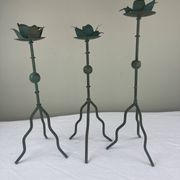 Sculptural candle holder trio
