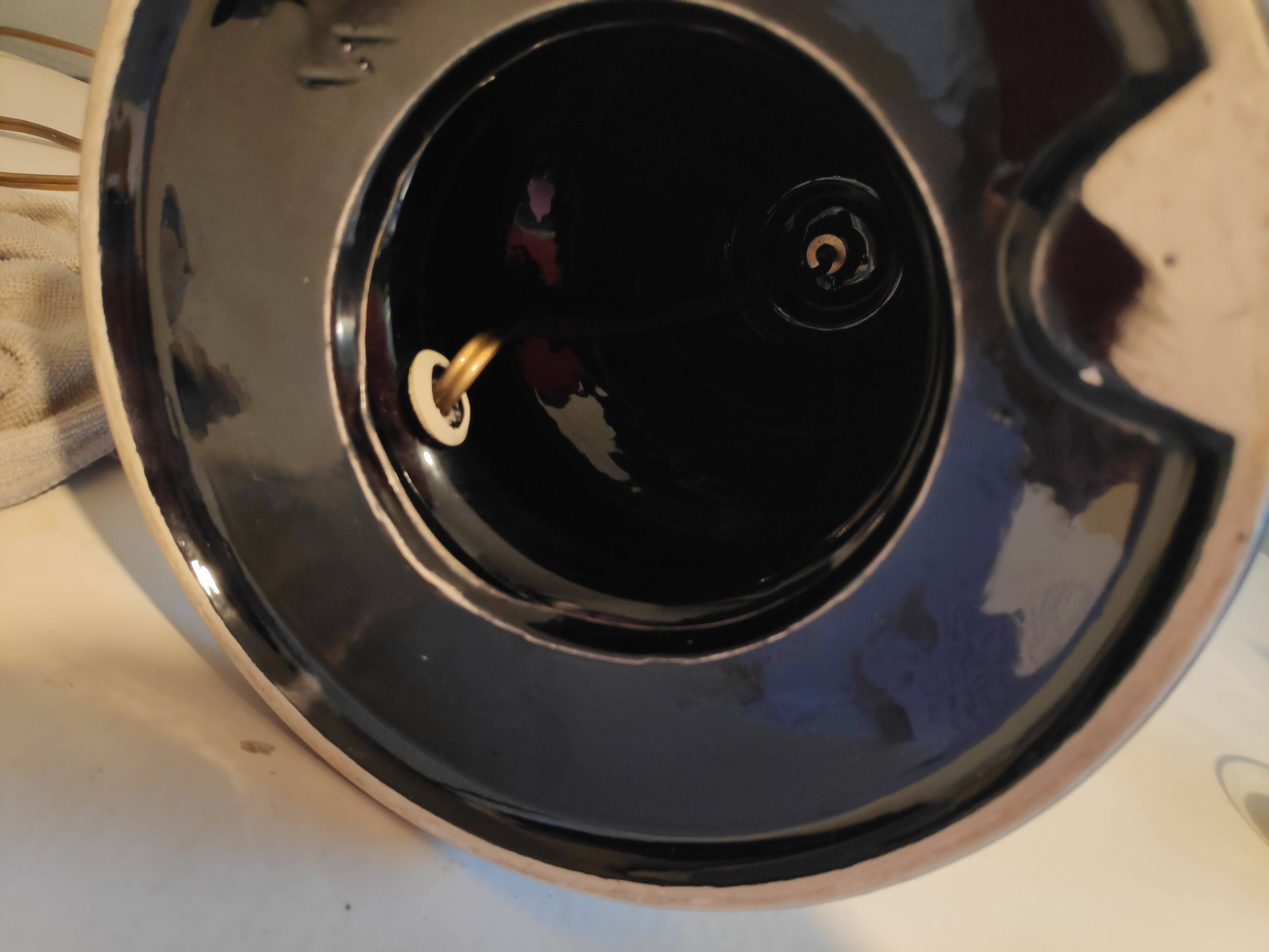 Black ceramic foot lamp and beige fabric lampshade