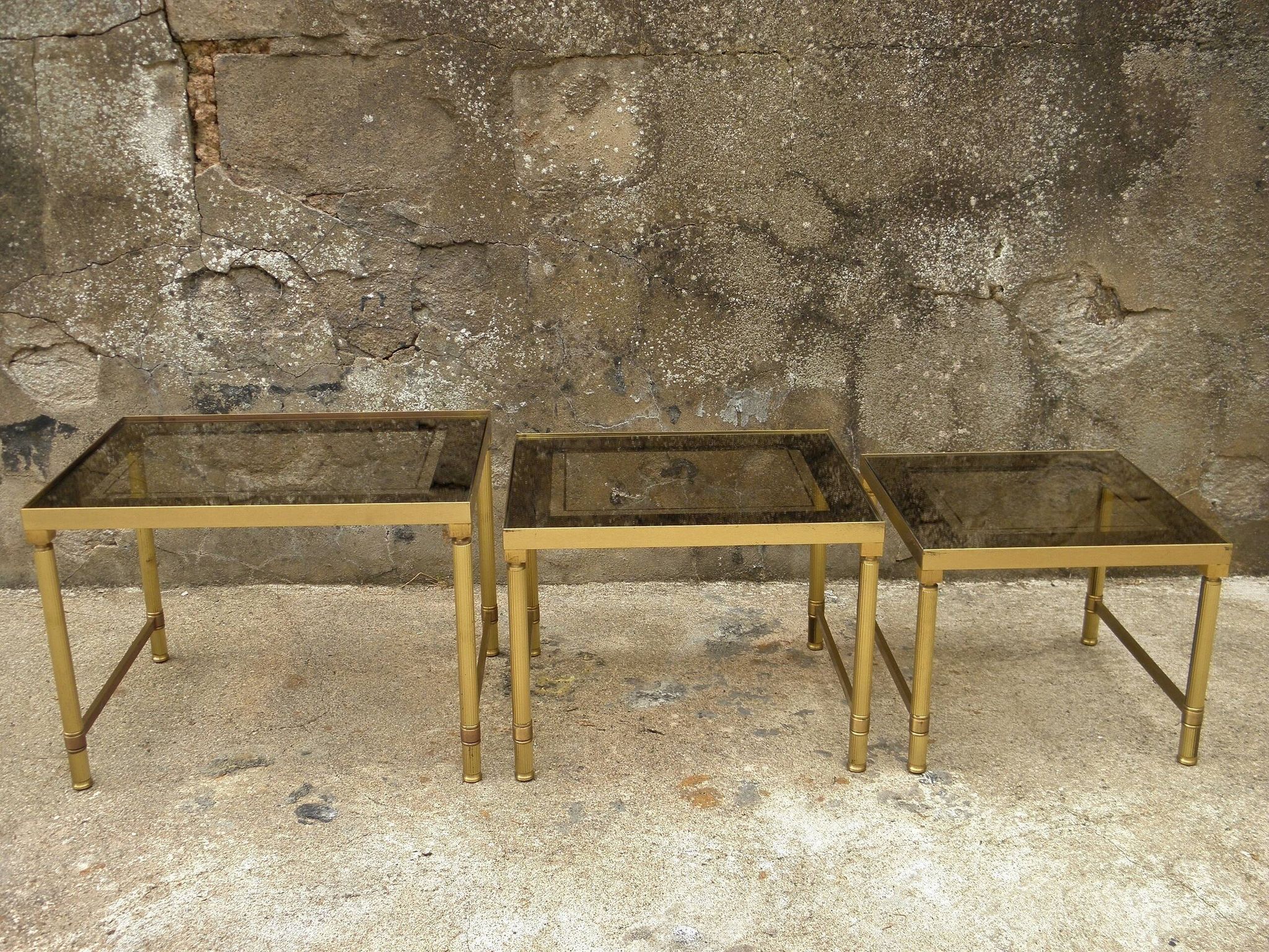 Brass, gold metal and 70s mirror glass tables