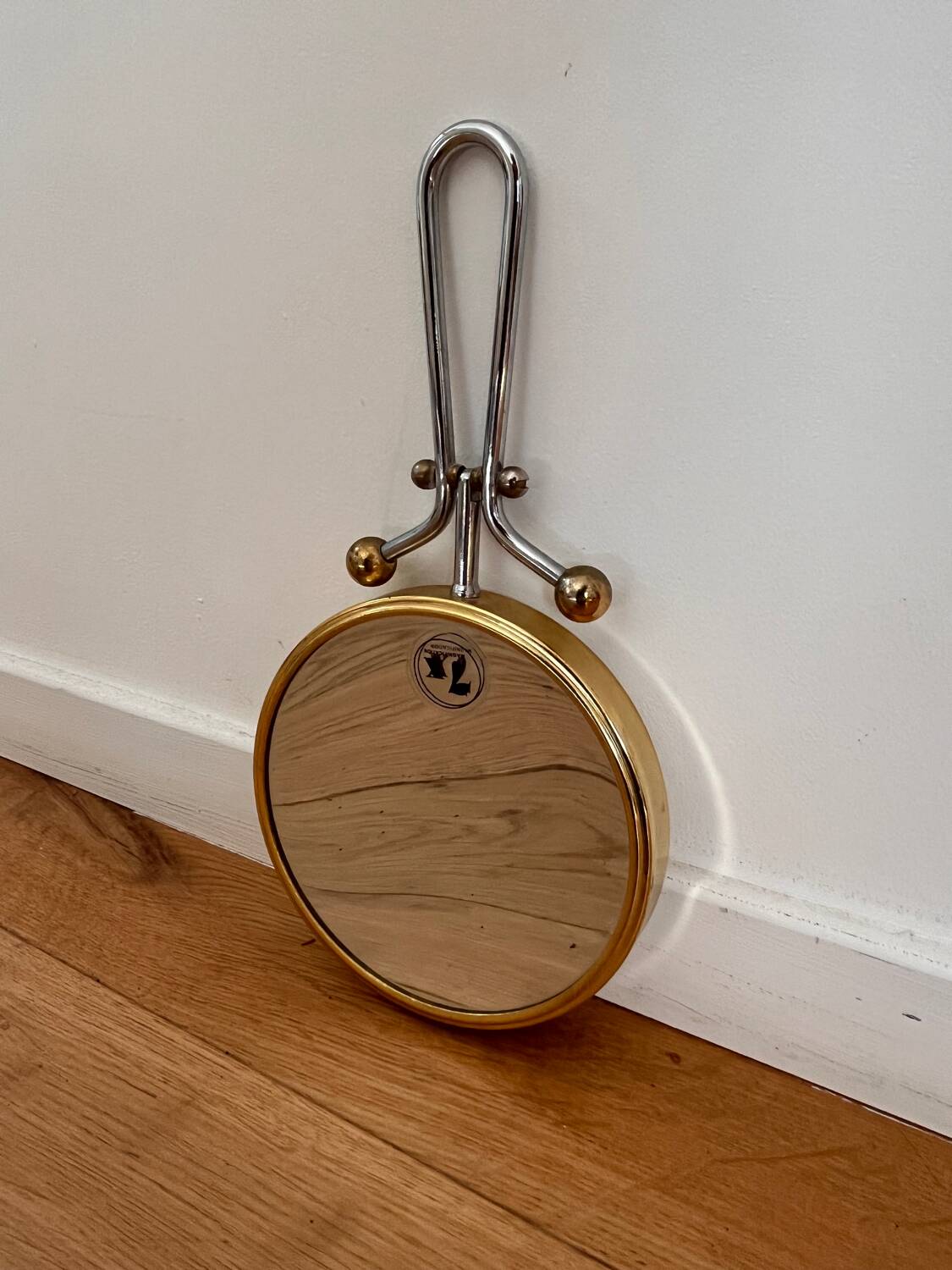 Magnifying brass mirror