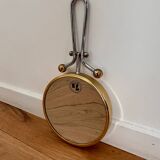 Magnifying brass mirror