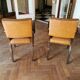 Pair de fauteuils art déco cuir capitonné