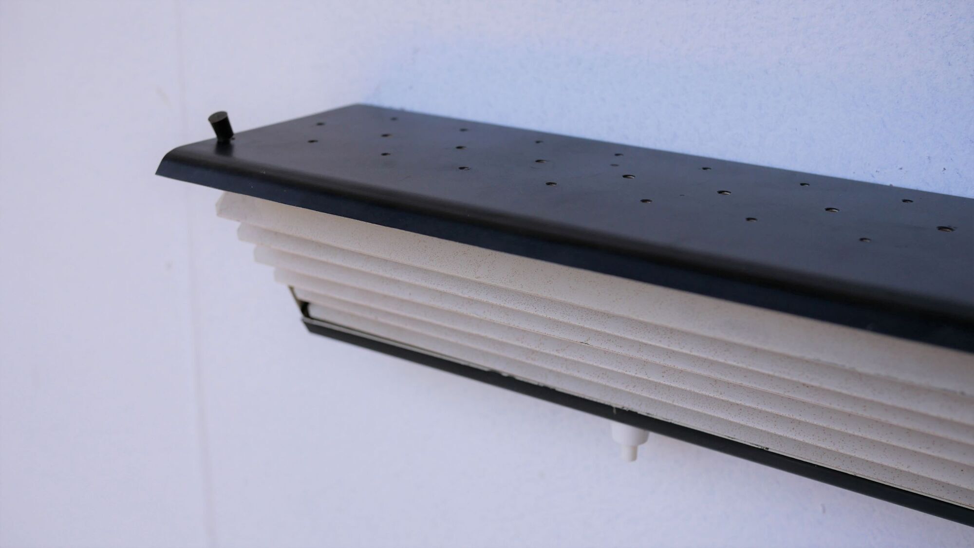 Pair of modernist metal wall light model 212, by Jacques Biny for Luminalite