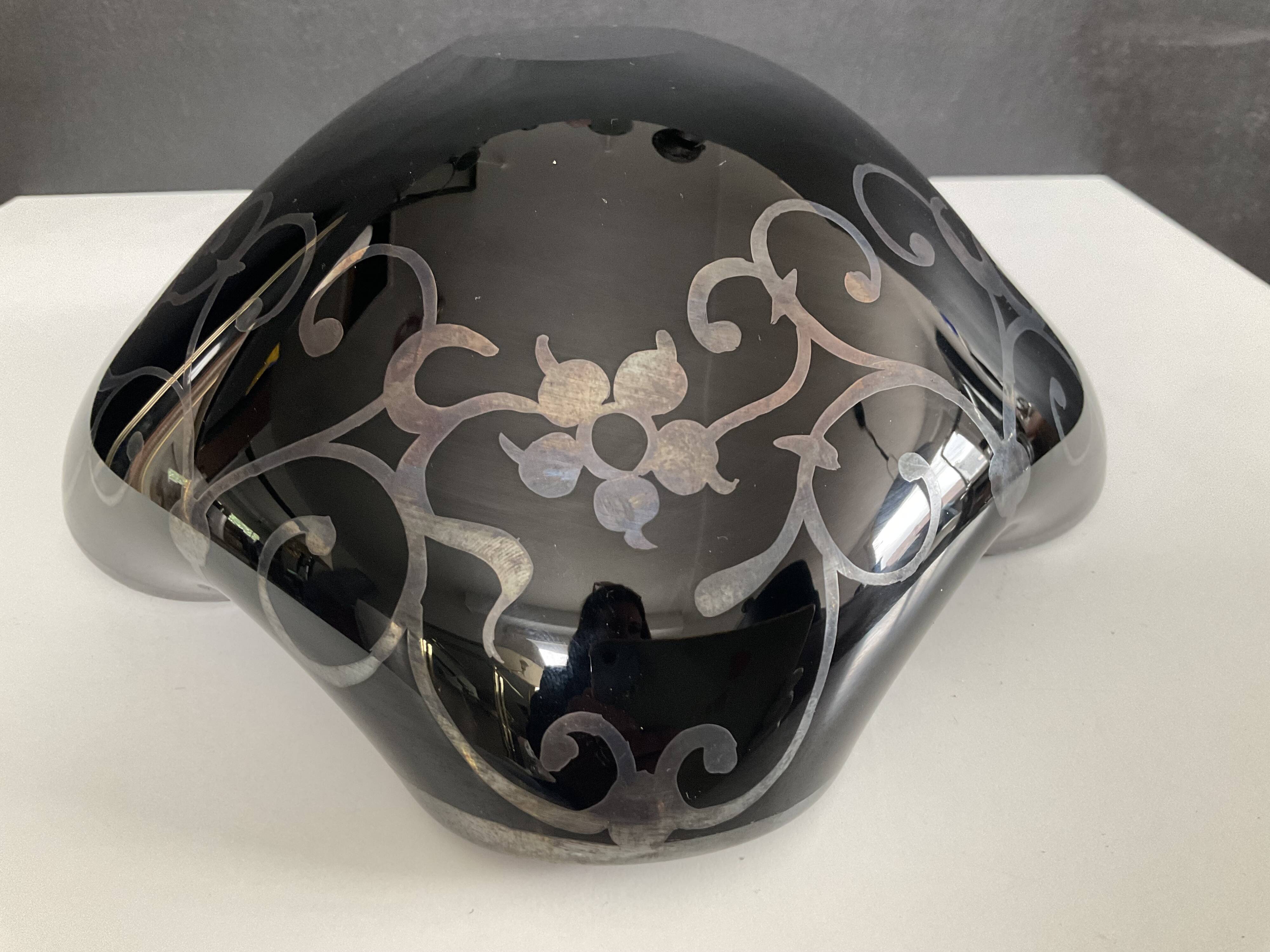 Vintage glass and silver catchall.