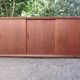 Low sideboard with 3 sliding doors in teak. Denmark 1960