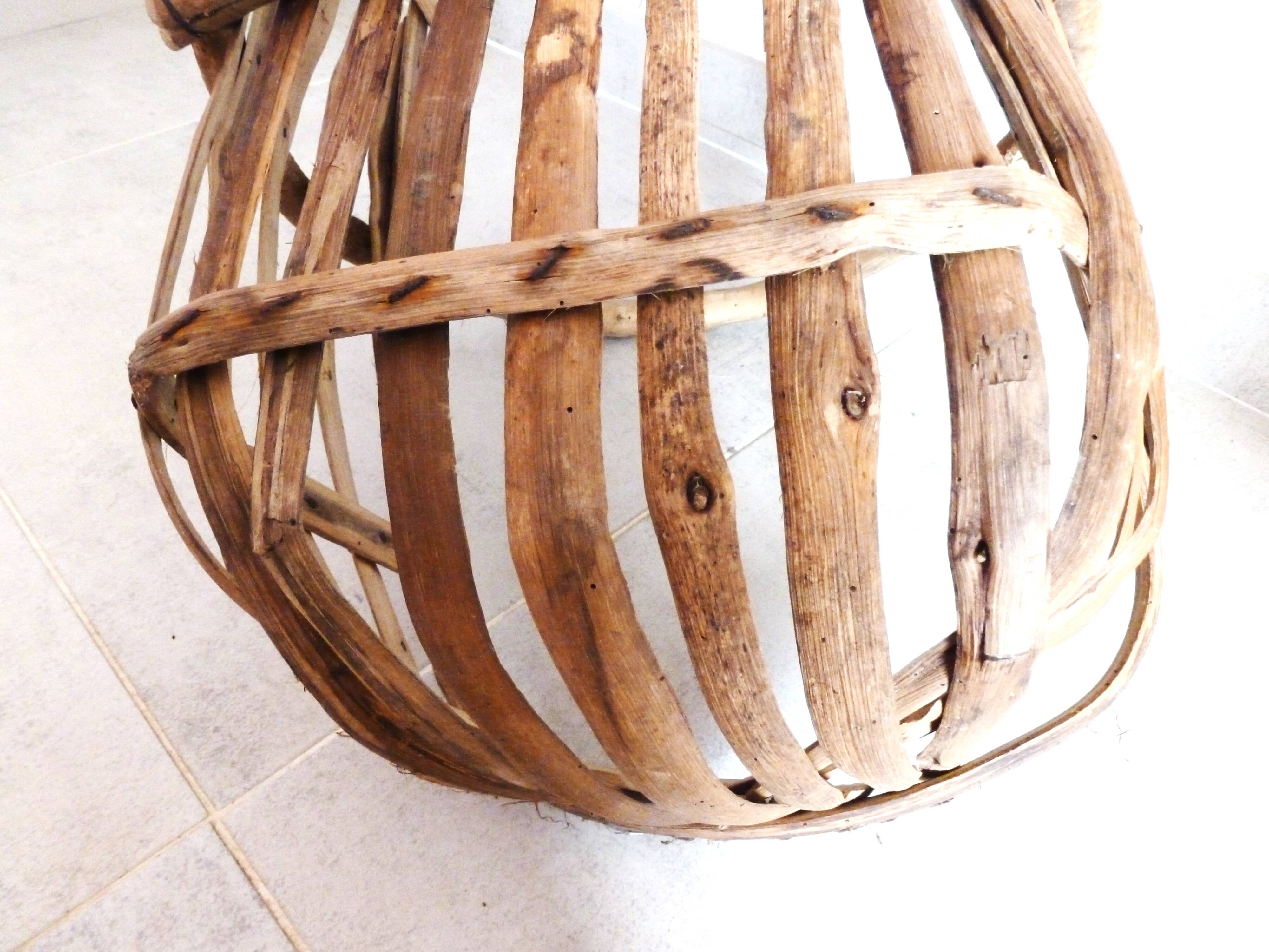 Old wooden harvest basket, slatted wooden basket, folk art.