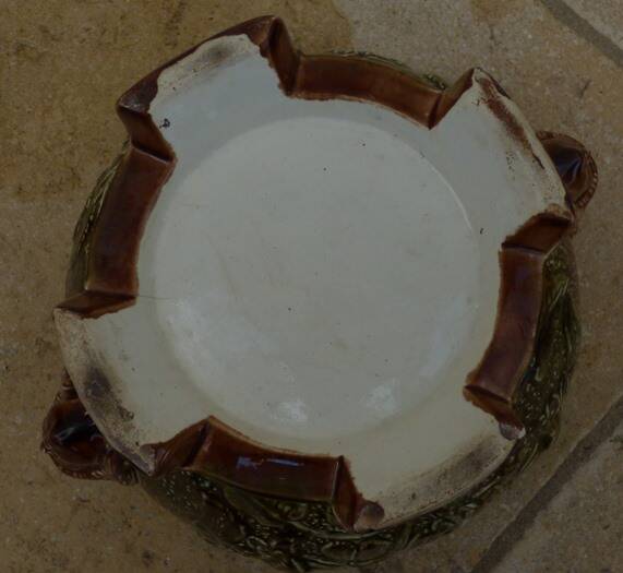 Old earthenware cachepot with woman decoration