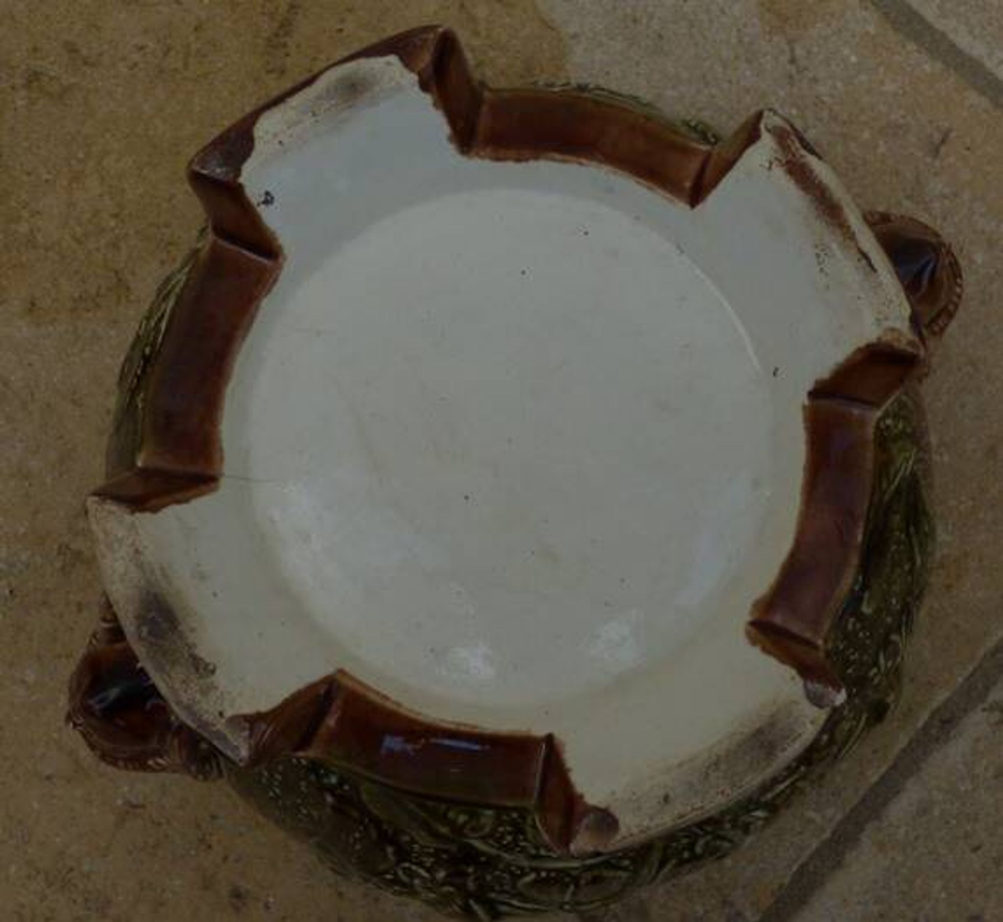 Old earthenware cachepot with woman decoration