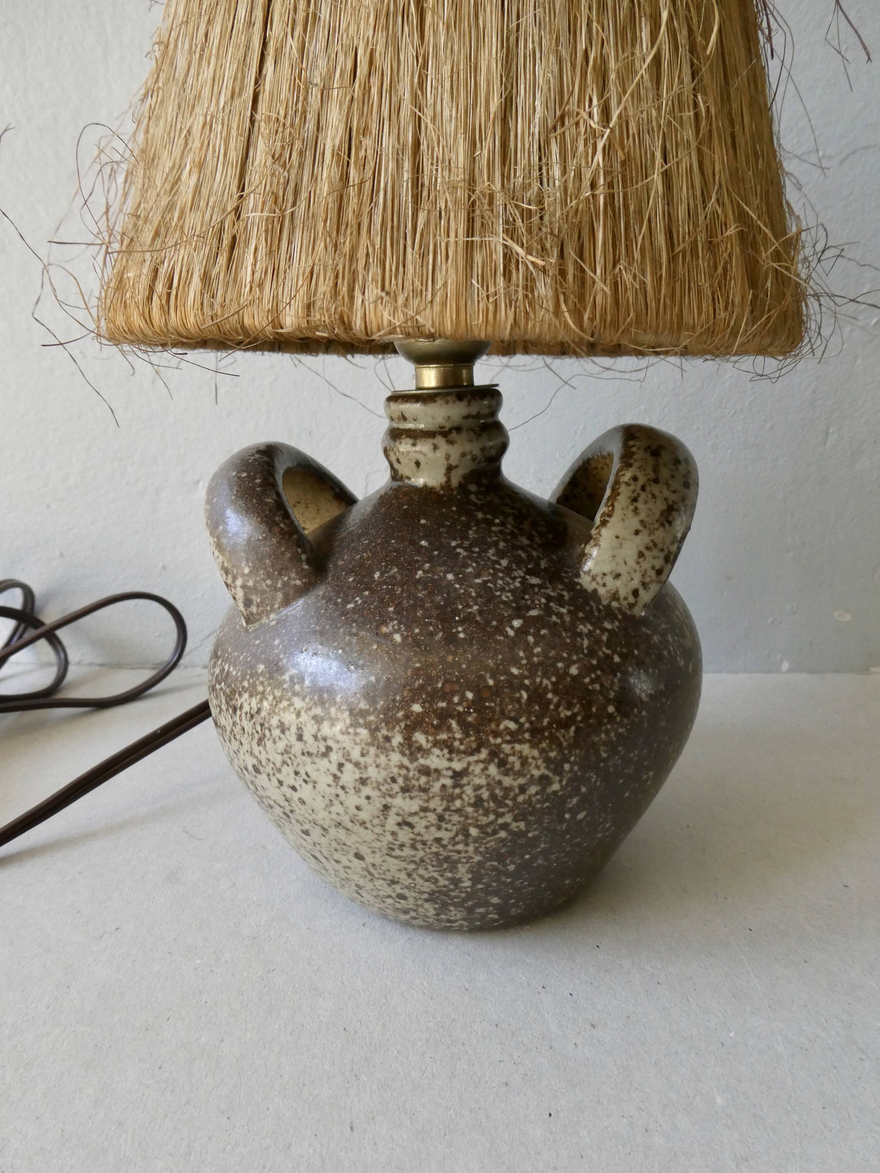 Sandstone lamp with natural fiber lampshade