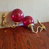 Pair of vintage brass wall light and cherry red globe